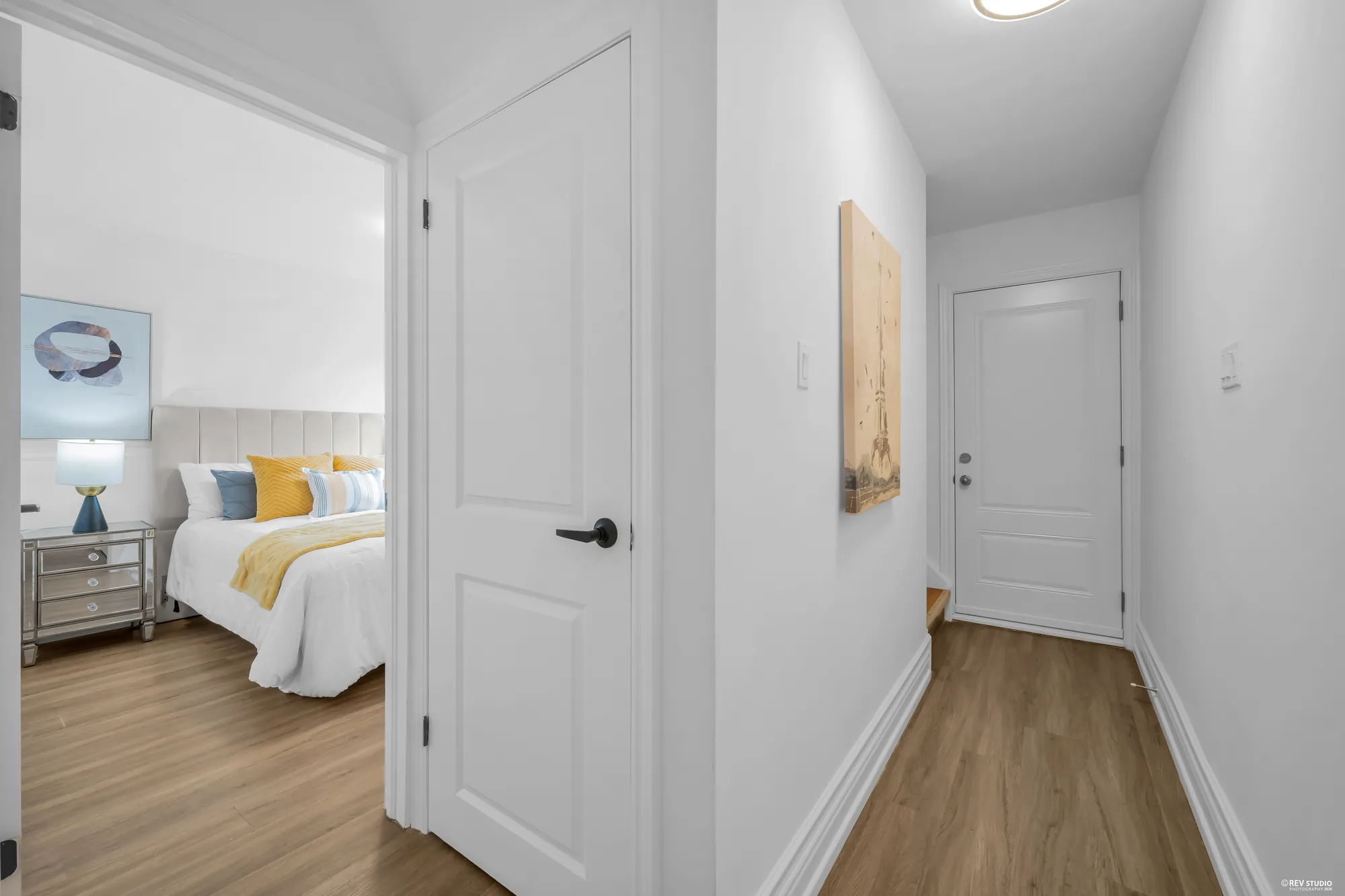 The hall between the bedroom door and the side entrance