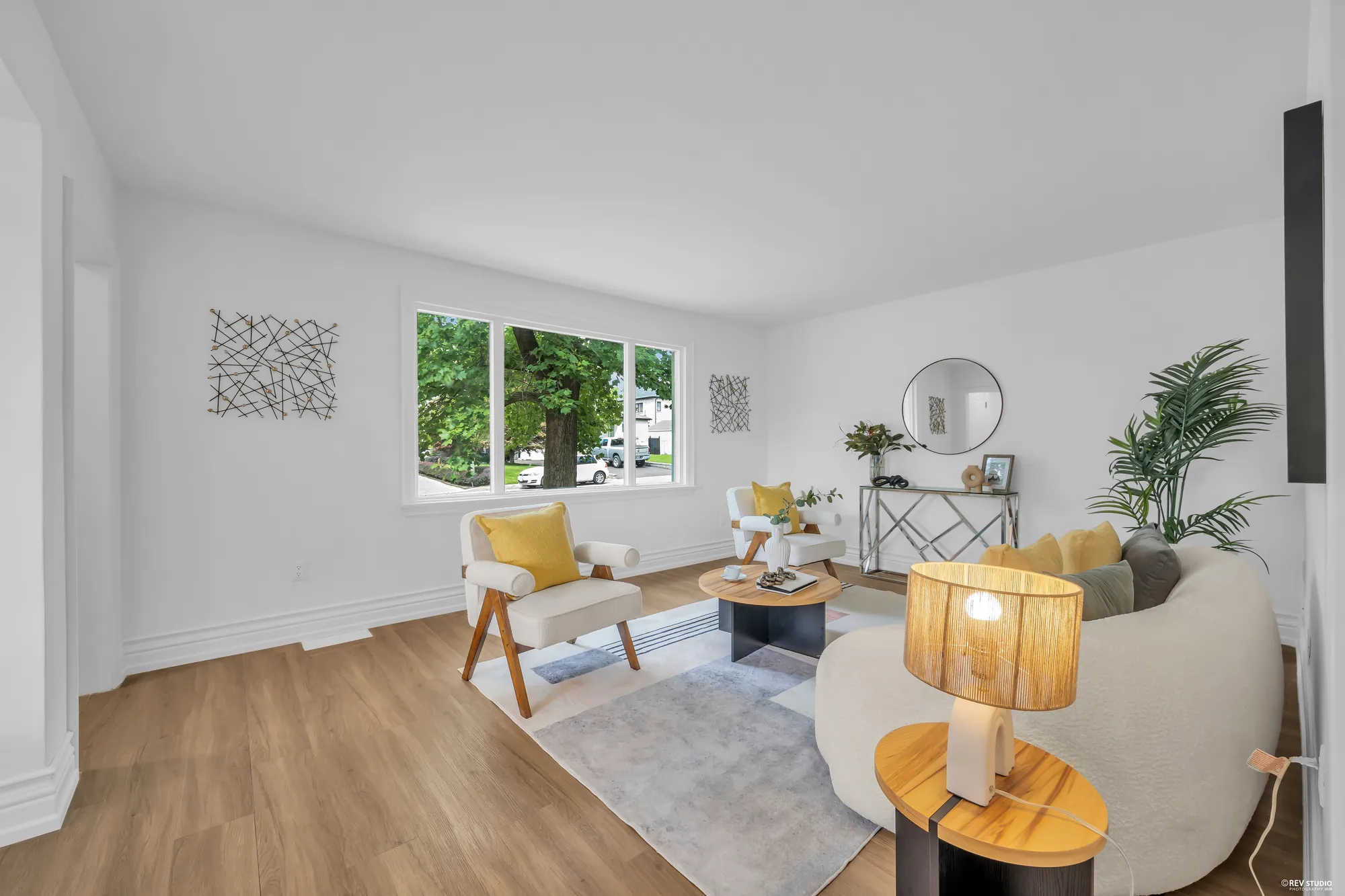 The living room from the dining room side showing the front window