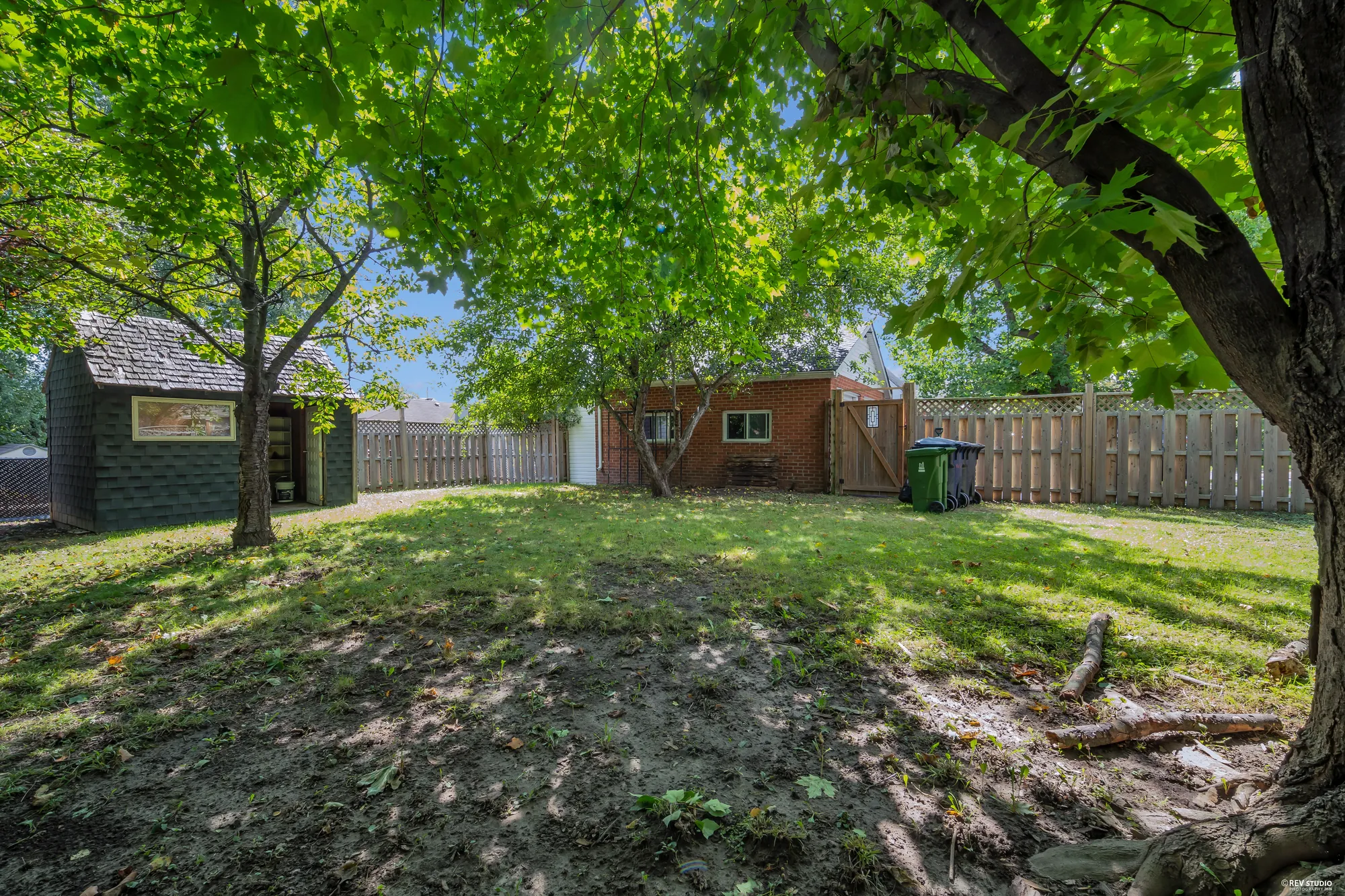 The back yard from the far corner looking toward the house